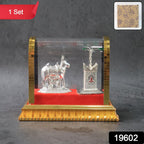 Sacred Kamdhenu cow and calf silver-plated idol with red velvet base