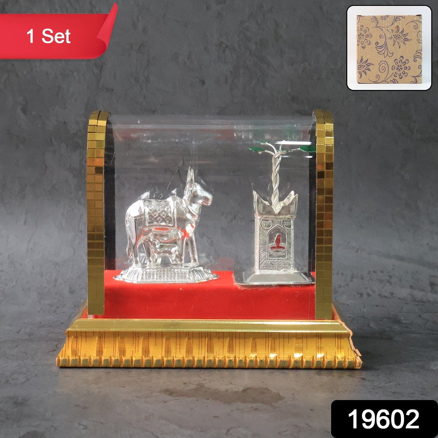 Sacred Kamdhenu cow and calf silver-plated idol with red velvet base