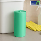 Close-up view of biodegradable green garbage bag roll packaging