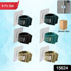 Close-up image of self-adhesive holder clips gripping broom handles securely