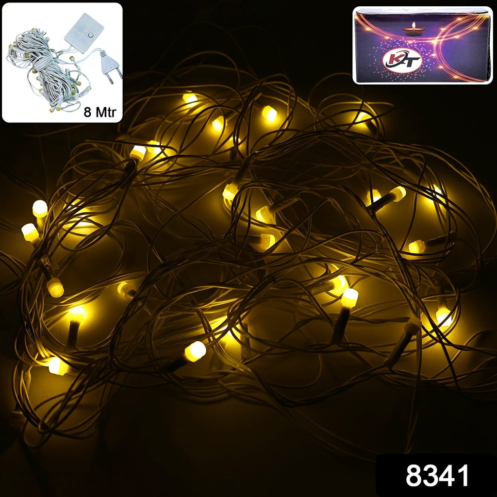 Close-up view of warm white fairy lights on flexible wire