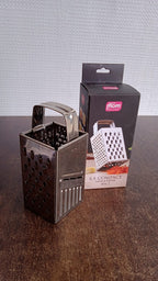 Supermom 4-in-1 stainless steel grater displayed in a home kitchen setup