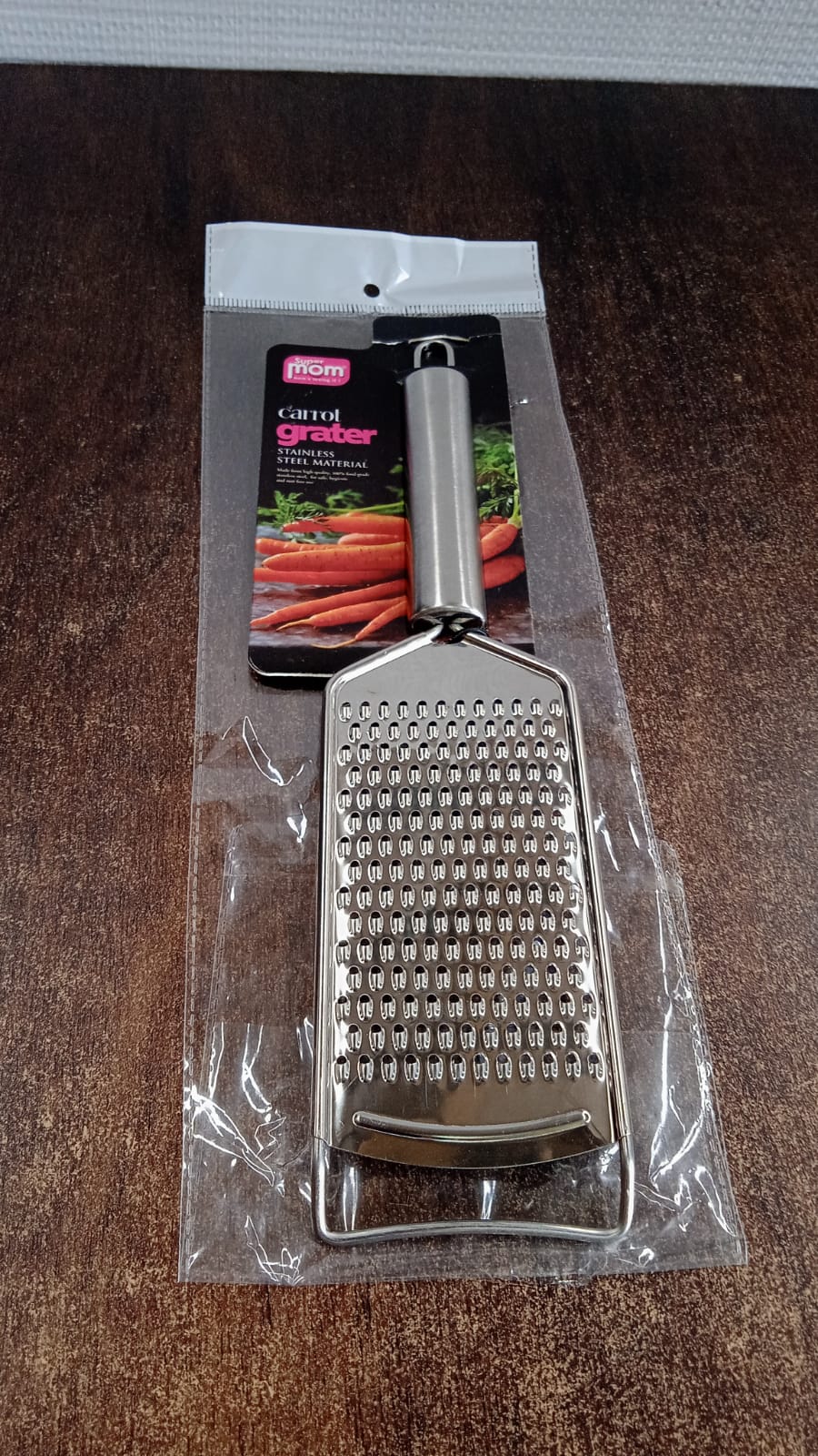 Neutral kitchen image showing stainless steel grater tool