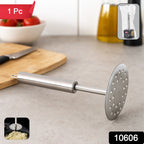 Close-up of stainless steel potato masher mashing potatoes smoothly