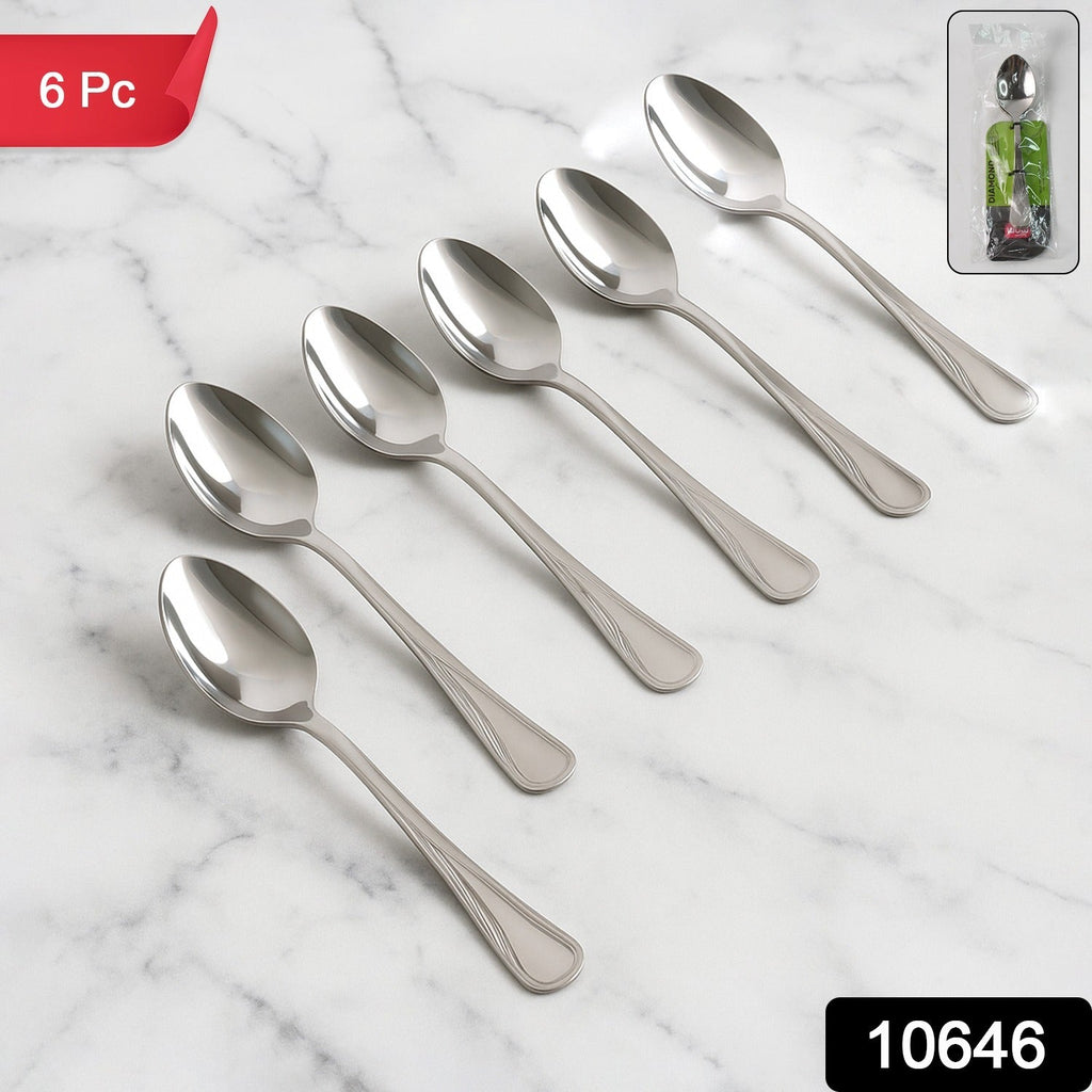 Six stainless steel dining spoons neatly arranged in a set