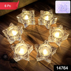 Star-shaped LED tealight candles glowing softly indoors