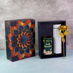 Premium Kulfi Almonds gift hamper with golden rose and stainless steel bottle in festive packaging