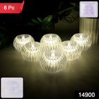 Close-up of crystal design LED flameless tealight candle glowing warmly