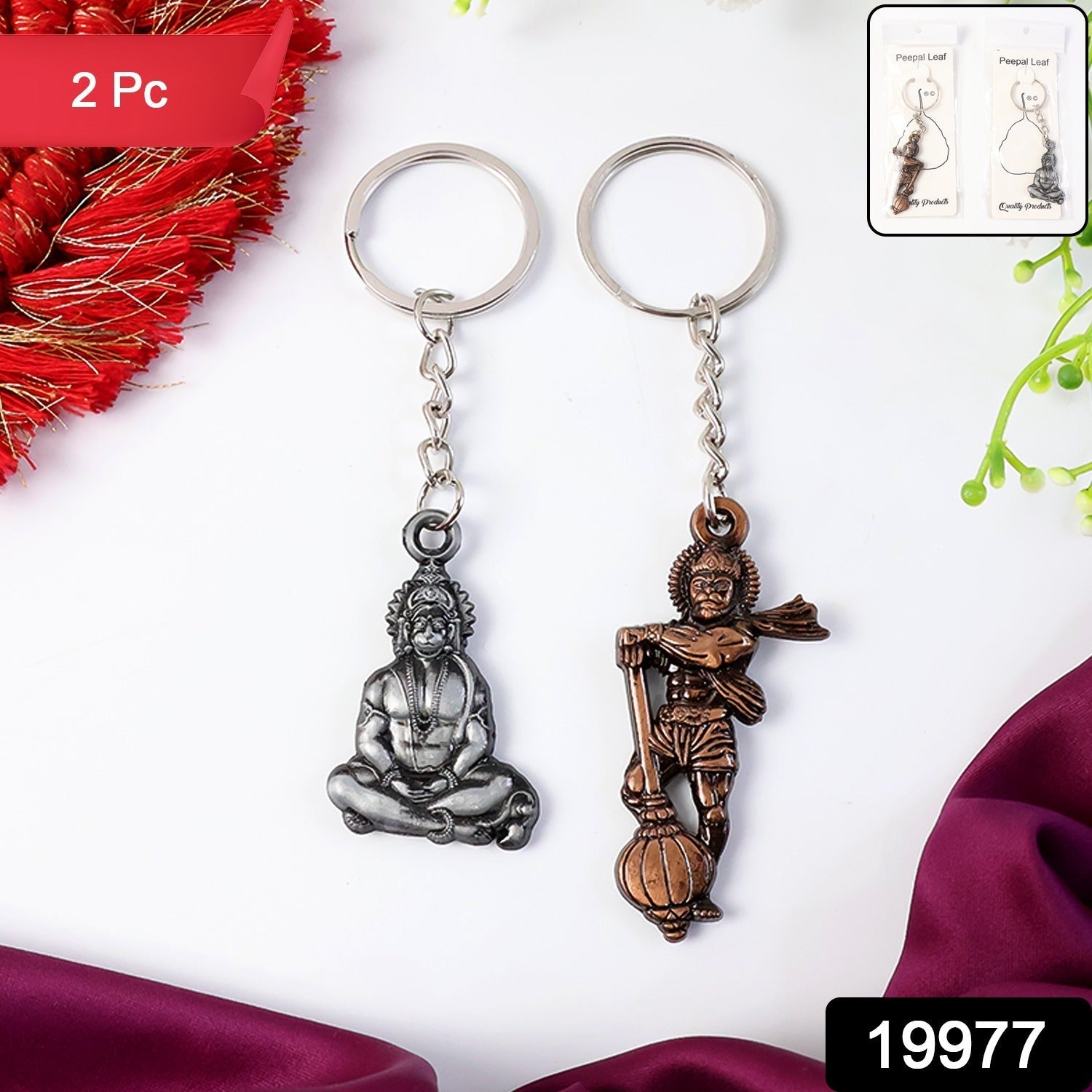 Close-up of Hanuman metal keychain attached to a keyring