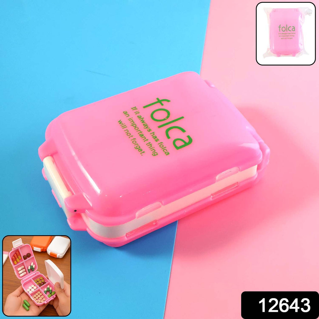 Open pink pill box showing dual-sided compartments for pills