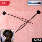 Close-up of black heart-shaped hairpins styled in hair for a chic look