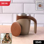 A self-stirring coffee mug effortlessly mixing a beverage with its magnetic mechanism.