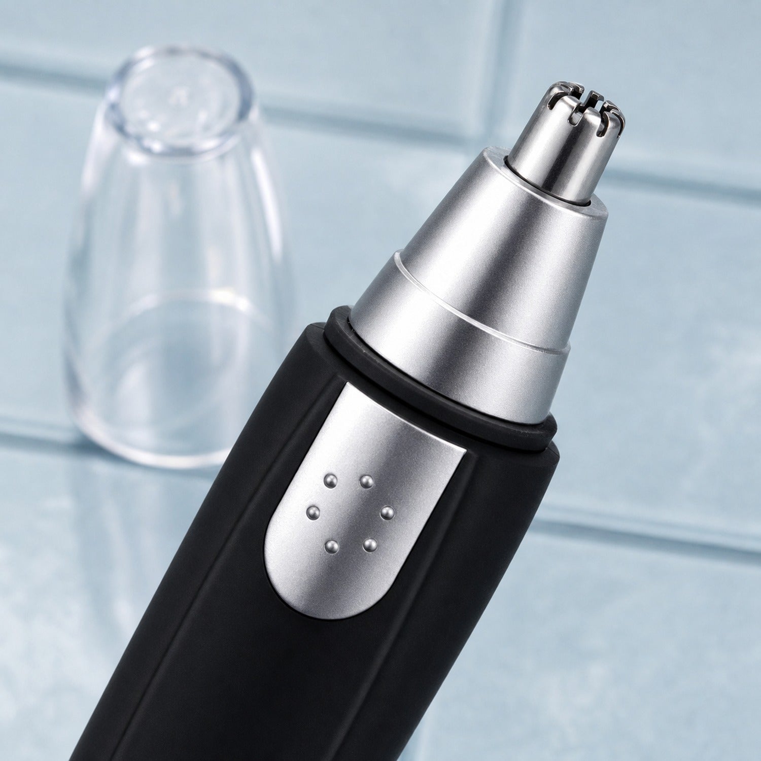 Cleaning brush included with the ear and nose hair trimmer for easy maintenance.