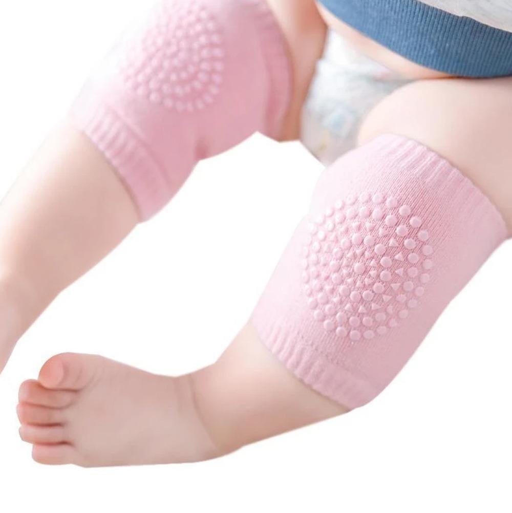 Comfortable and supportive knee guard pads for toddlers, in a natural setting.
