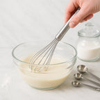 Compact stainless steel whisk ideal for mixing and blending ingredients