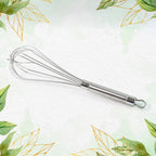 Apex stainless steel whisk resting on kitchen countertop