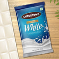 Chocotown White Compound Chocolate slab presented on a cutting board, ready for use in baking.