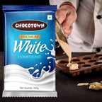 A large block of Chocotown White Compound Chocolate with a knife, suggesting ease of portioning.