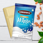 Pieces of Chocotown White Compound Chocolate broken from the slab, showing its smooth texture.