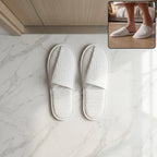 Hotel style white slippers for guest rooms