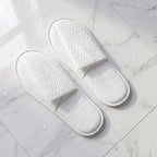 White disposable slippers with cushioned soles