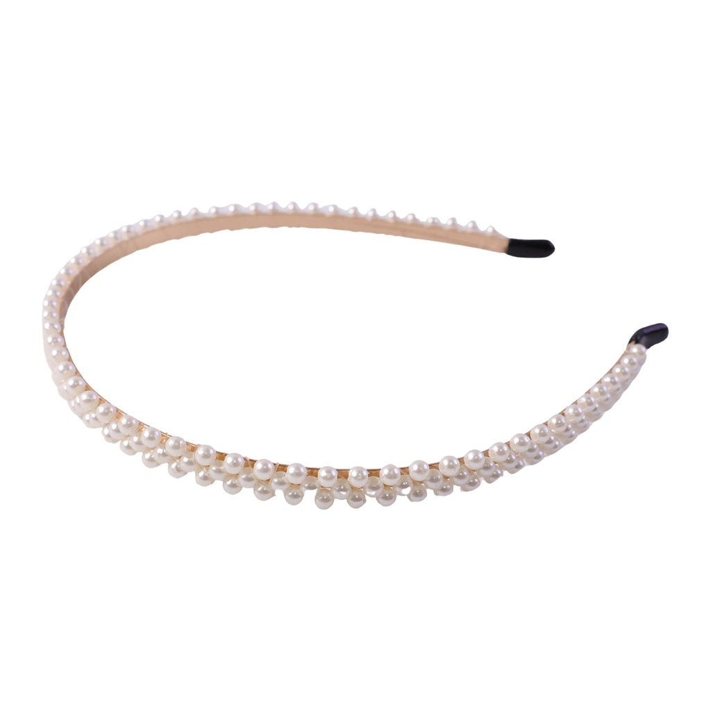 Elegant white pearl hairband, angled view showing details