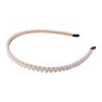Elegant white pearl hairband, angled view showing details