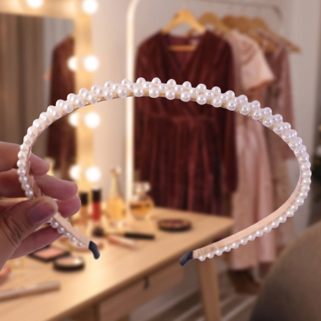 Pearl hairband on a model's head, showcasing full style
