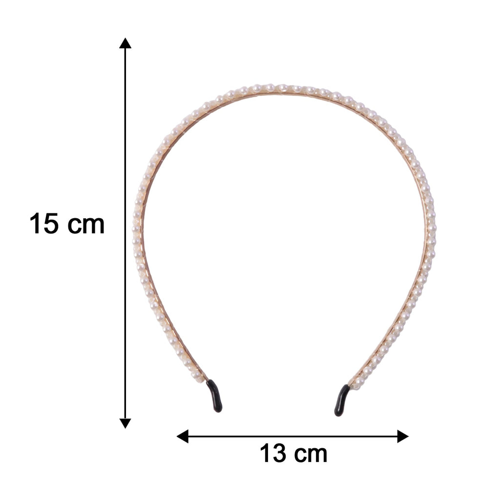 Side view of woman wearing a pearl hairband, fashionable look