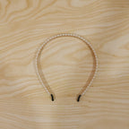 Pearl hairband featuring delicate white beads for a chic look