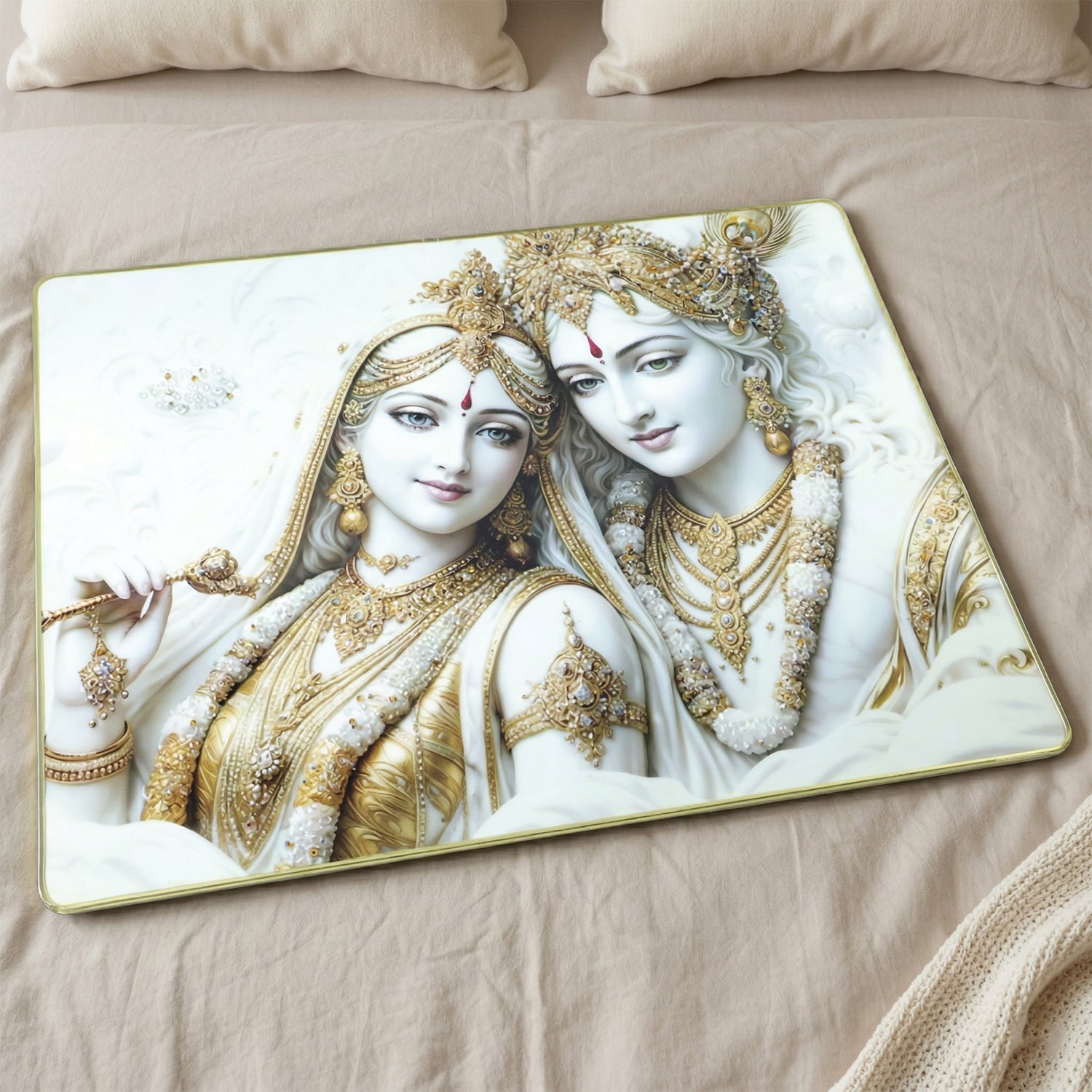 Close-up of intricate Radha Krishna artwork in white and gold