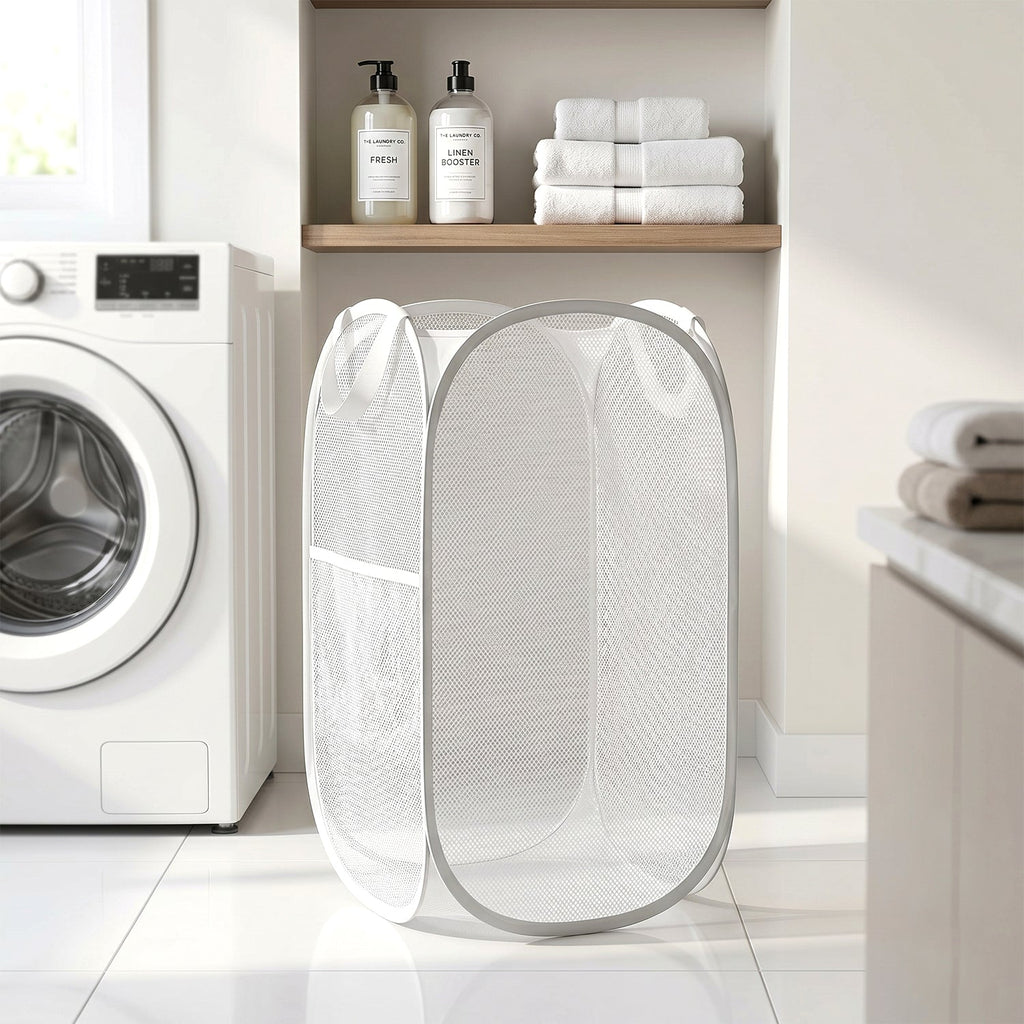 Portable laundry basket in white mesh with handles
