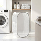 Portable laundry basket in white mesh with handles