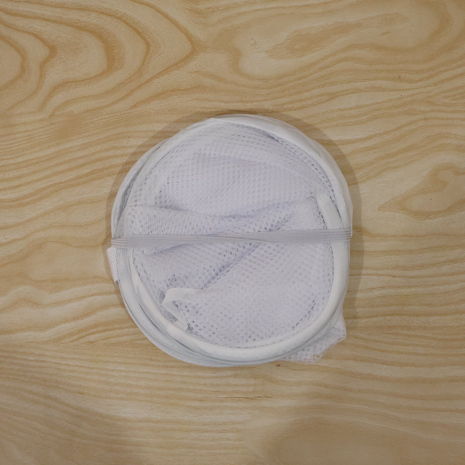 Foldable clothes hamper with handles for easy transport