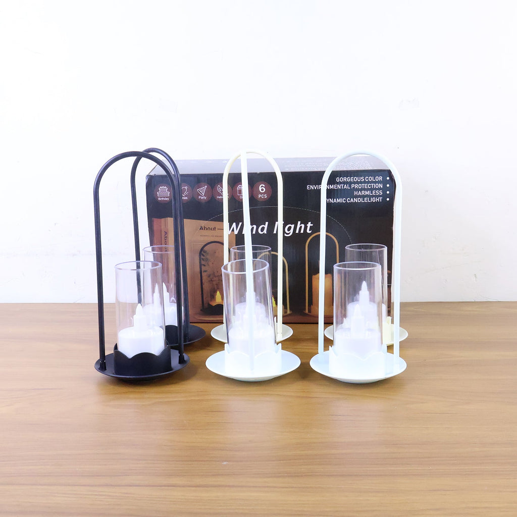 Big wind light style flameless LED candle set glowing softly in home décor setting