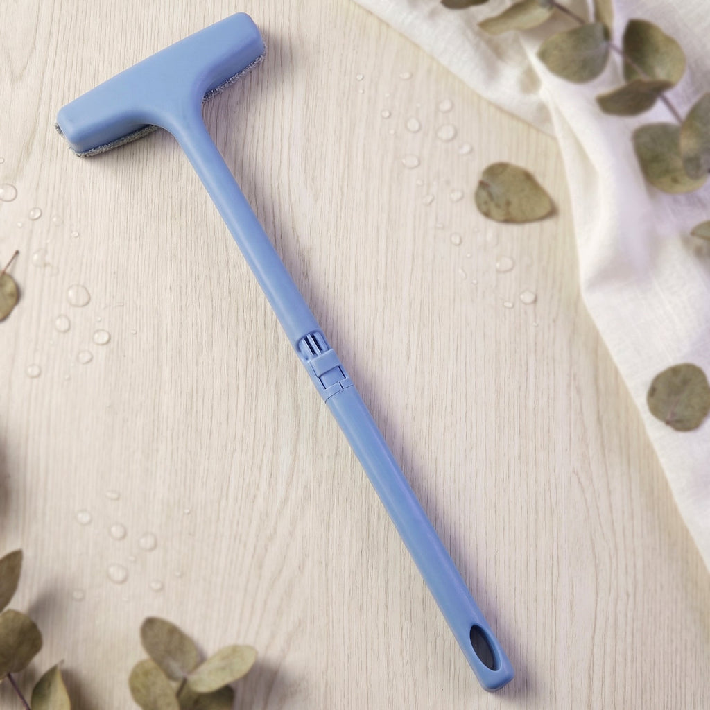 The soft bristles of the window mesh cleaner gently cleaning delicate screen surfaces.