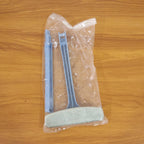 Close-up of the dual-sided brush head on the window mesh cleaning tool.