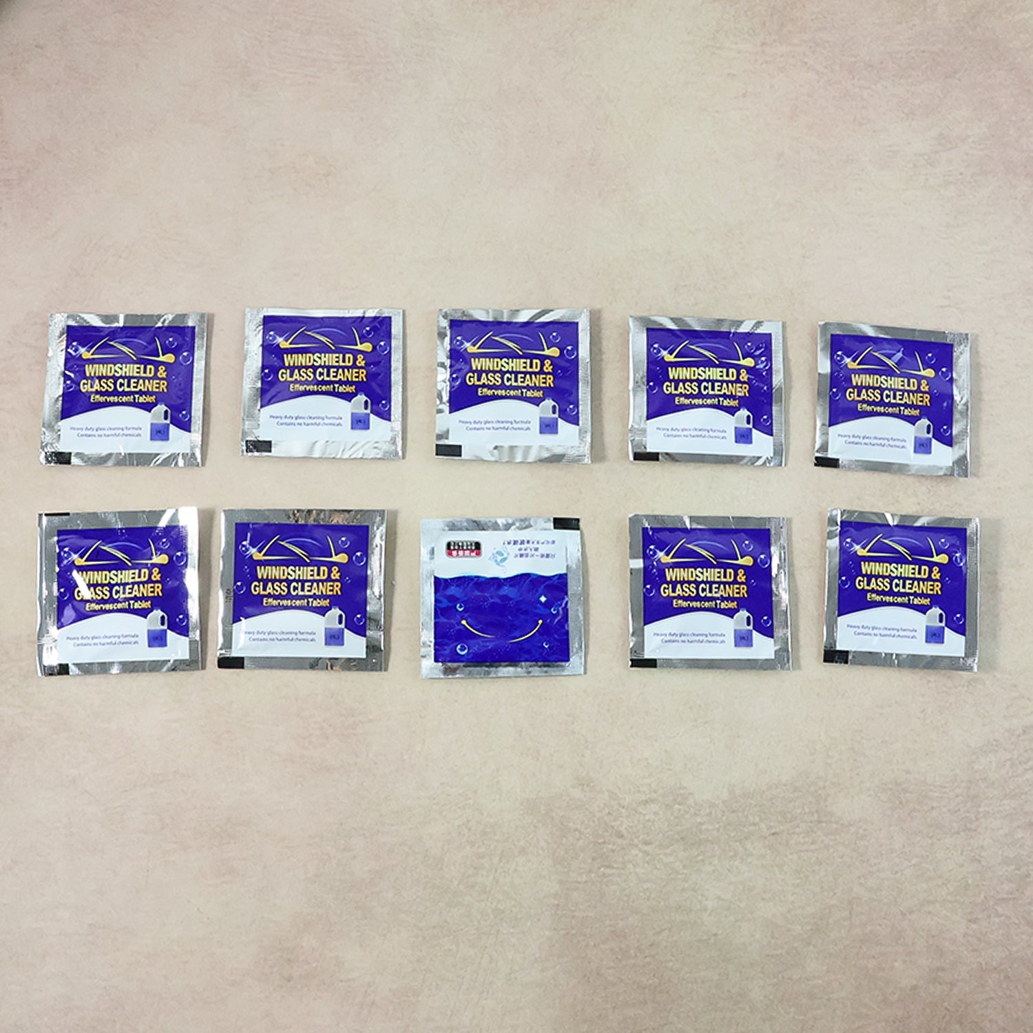 Display of effervescent car windshield cleaner tablets for vehicle maintenance