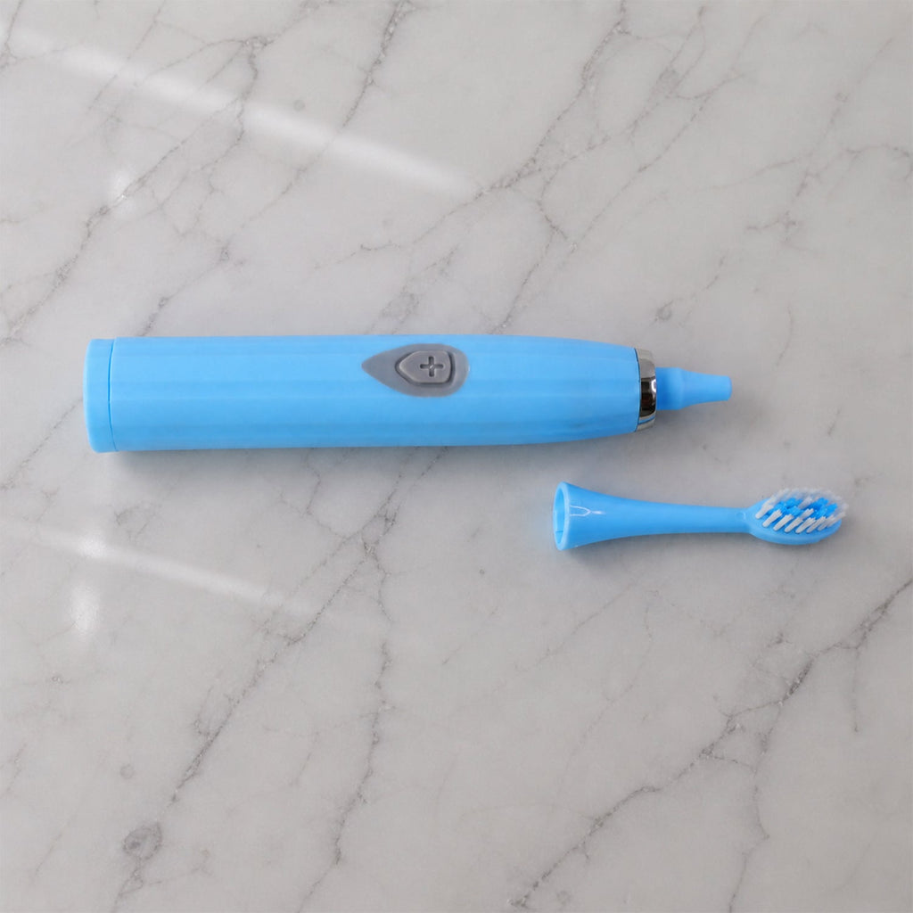 The travel electric toothbrush with its protective cap on, ready for packing and transport.
