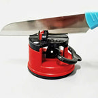 Manual knife sharpener featuring a robust suction cup base for stability.