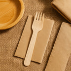 Freshee 160mm wooden fork placed next to plated meal