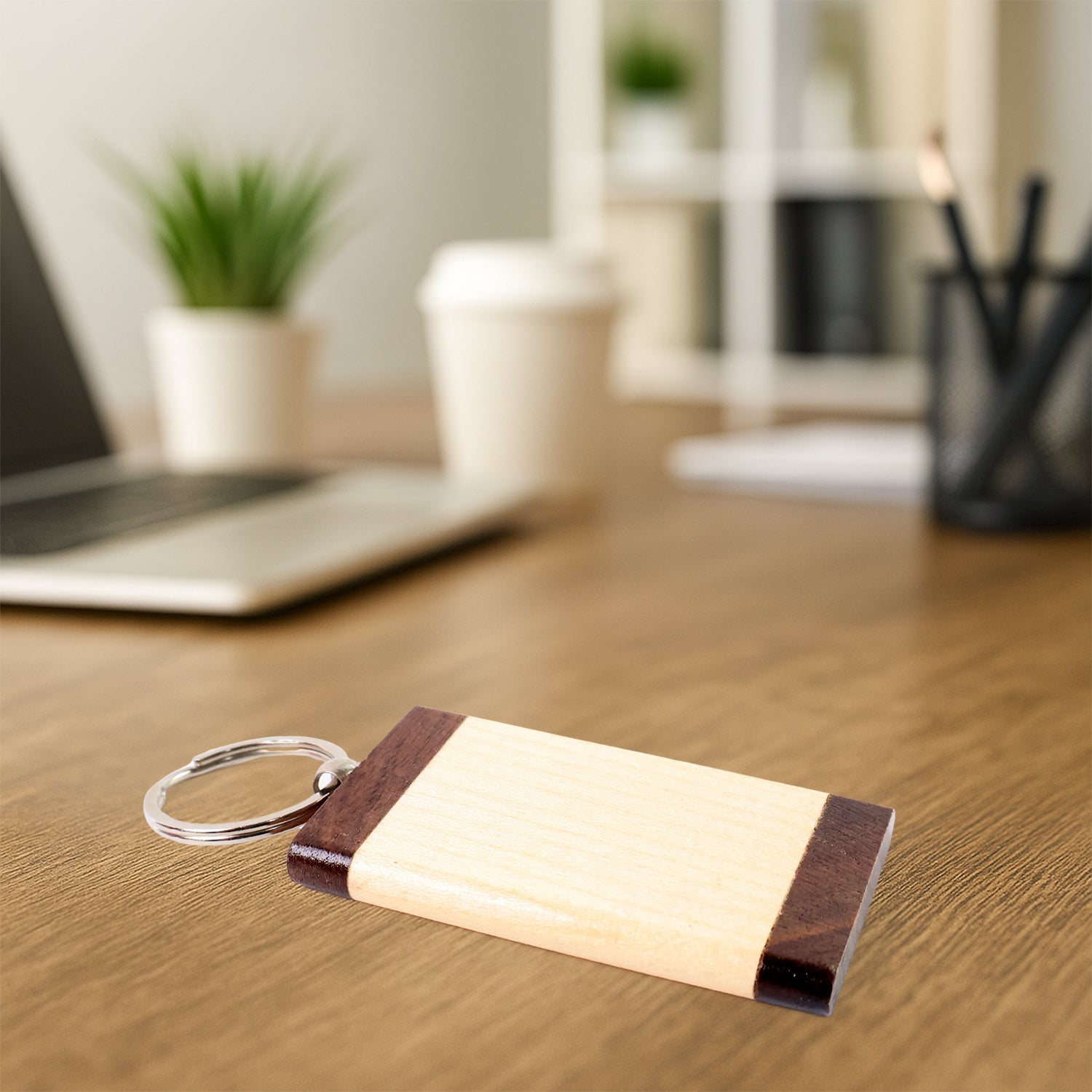 Side angle of wooden keychain showcasing minimalist rectangular design