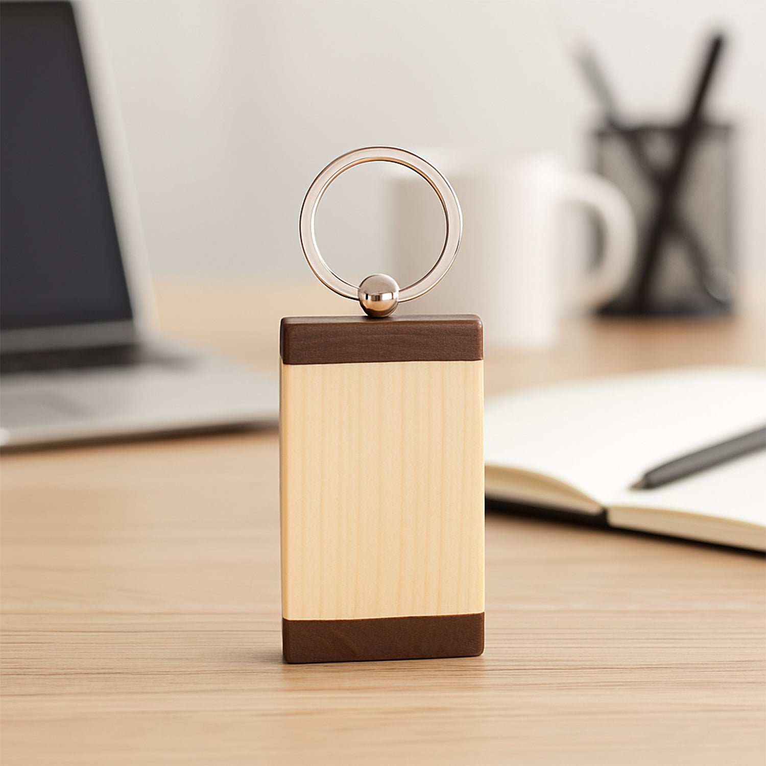 Top view of wooden keychain with dual-tone finish and metal ring