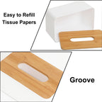 Bamboo tissue box holder placed on a wooden table in a cozy living room setting.