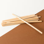 Close-up view of smooth, splinter-free wooden coffee stir sticks