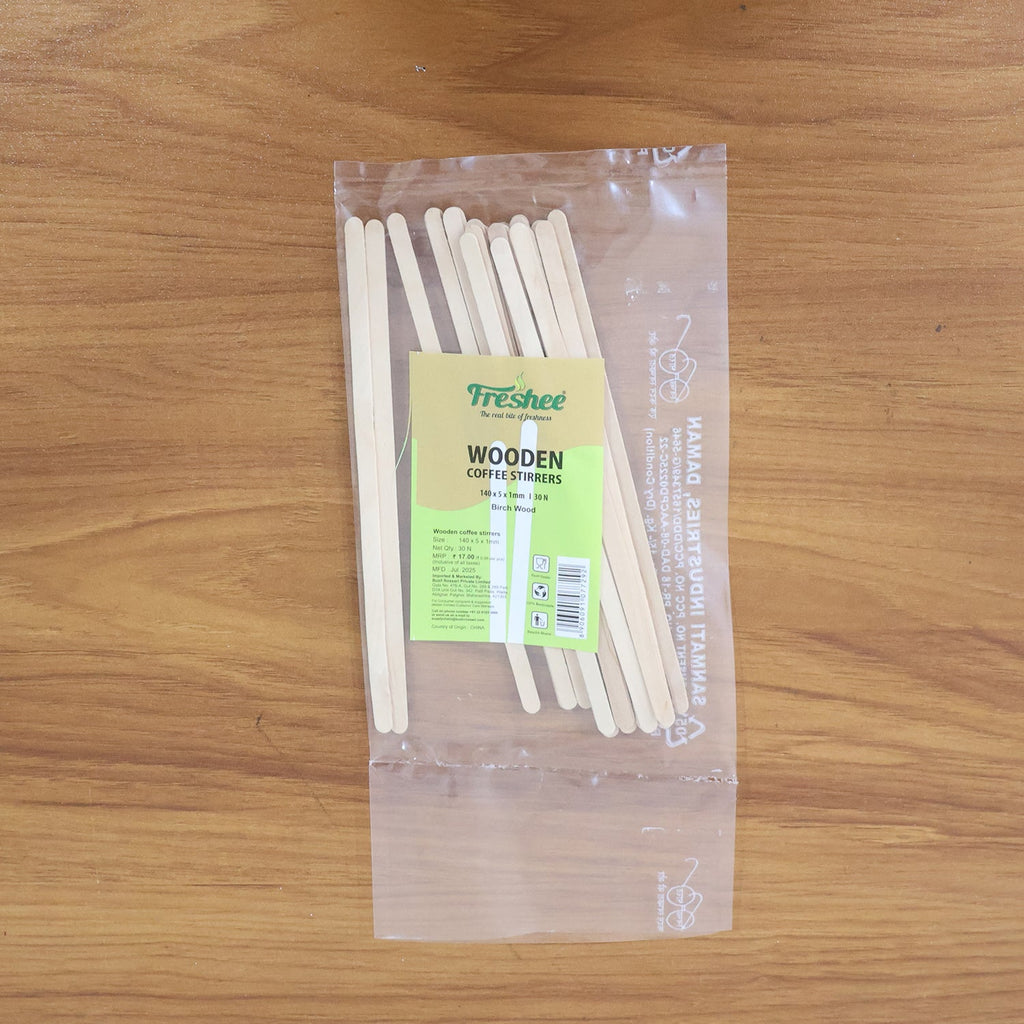 Wooden coffee stir sticks placed inside a cup with drink