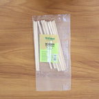 Wooden coffee stir sticks placed inside a cup with drink