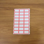 Close-up showing multiple sheets of blank writable self-adhesive shipping label stickers