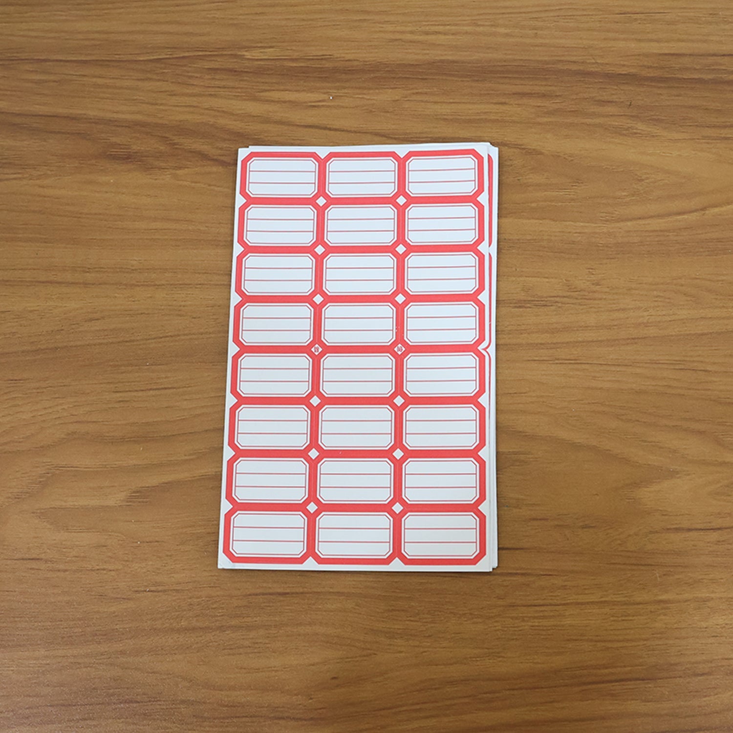 Close-up showing multiple sheets of blank writable self-adhesive shipping label stickers