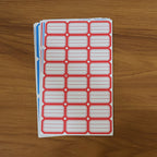 Backing side of writable label stickers showing strong adhesive layer